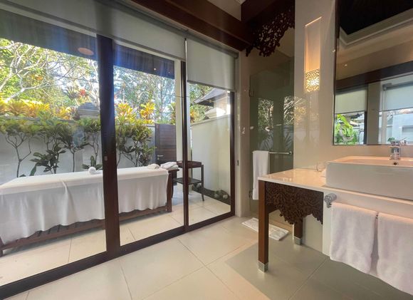 Massage table in outdoor area of Master bath