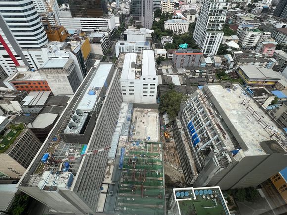 Both the building on the left, facing Surawong, and the one on the right are being gutted and refurbished. 