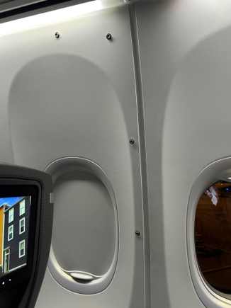 Attachments for crew rest curtain around seat 4F