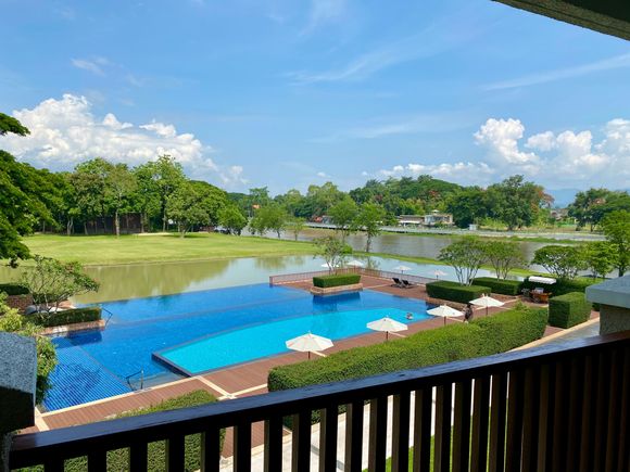 view from room overlooking pool and river
