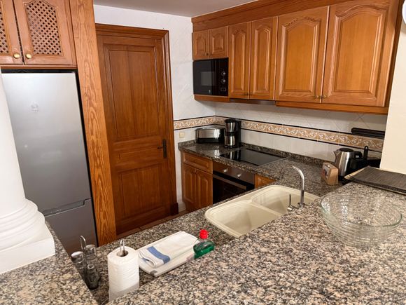 The kitchen is well equipped and quite clean