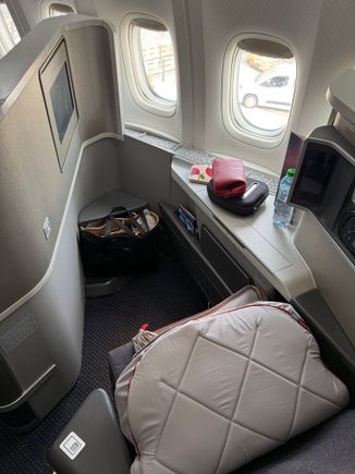 Hello to my lovely windows. First flight with the new mattress pad, which was incredible. So comfortable and cleaner feeling than the seat. I had to leave the Centennial amenity bag behind, my luggage was filled to the brim and I had a connecting flight out of JFK after.