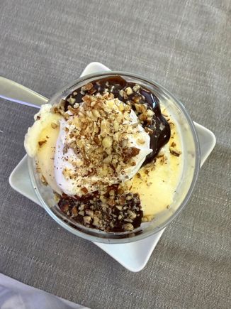 Traditional Ice Cream Sundae with hot fudge, whipped cream, chopped pecans. I don't think I could ever bring myself to choose a different dessert. This one was rock hard and not as good as the Haagen Dazs ice cream served outbound from the states, but no regrets.