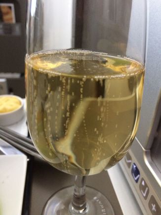 Replacement glass of chilled champagne with bubbles.