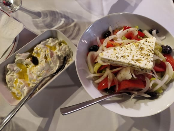 Tzatziki and Greek salad in Athivoli, Cretan restaurant in the street in the pic above