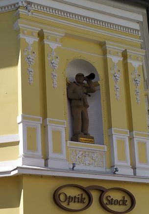 Some interesting details above this optician's shop