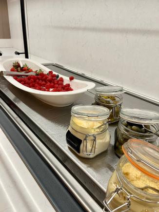 What a strange way to lay out the berries next to mayo and pickles.