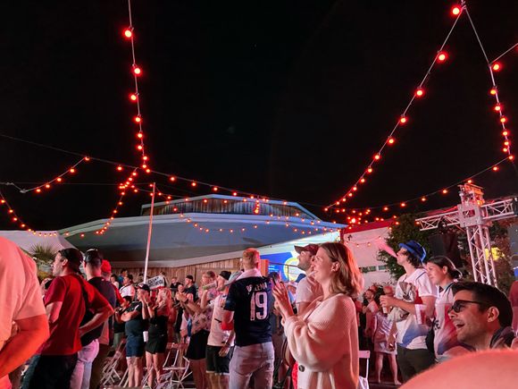 Fans watching the outside screen after team CZE wins the gold medal in tennis