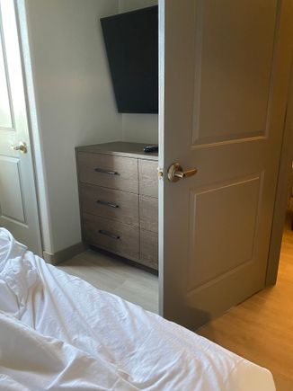 When bedroom door is open, it hits the dresser and allows only about a foot of space to walk to other side of room. 