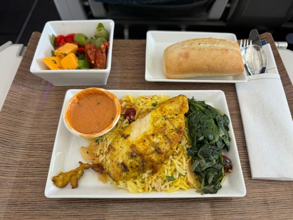Golden chicken with bastmati rice, rainbow chard and curry sauce.