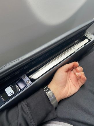 tray table has a lotch, so it comes out when you press it. much better than the manual ones. 