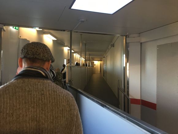 walk along corridor to immigration