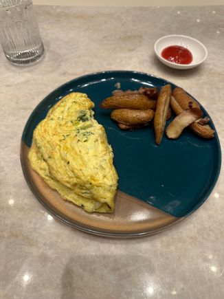 Omelette. It originally came out with mushrooms (not part of the order) so it was thankfully re-made. 