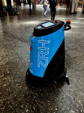 Robot vacuum cleaner in the check in area