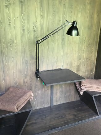Desk built into wall with closets on either side