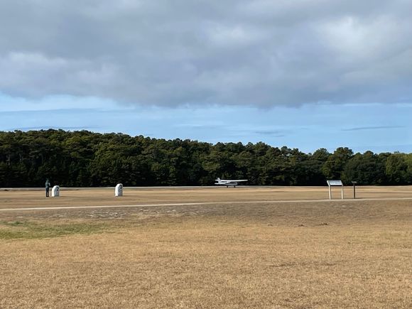 A plane landed and took of from the landing strip.  