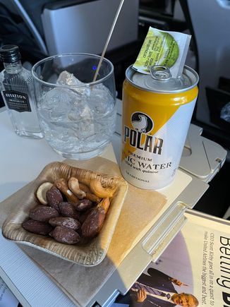 The nuts weren't warmed, at least by the time they got to me.  FA gave me a double G&T.