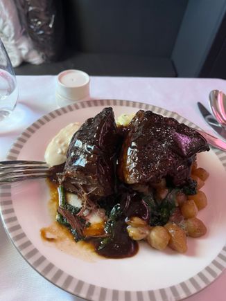 LHR to SIN 

BTC: Braised Beef short ribs. 

I was really looking forwards to this dish. Surprisingly  when I cut into it it was dry. Usually braised meat is moist when you cut into it. Thank goodness it was slathered in gravy. The gravy needed more "seasoning" and once I sprinkled more salt it tasted fine.

The portion was huge and that was satisfying.

I would not order this again as it was somewhat tasteless. 6.5/10 would be a 6 but as I had stated, it was a large portion. 