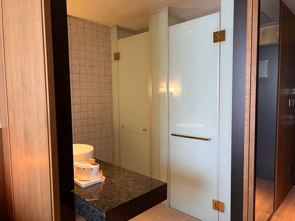 Open bathroom with sliding wood panels