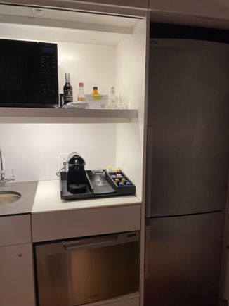 Full size fridge, microwave, nespresso, sink, dishwasher plus plates cups and cutlery