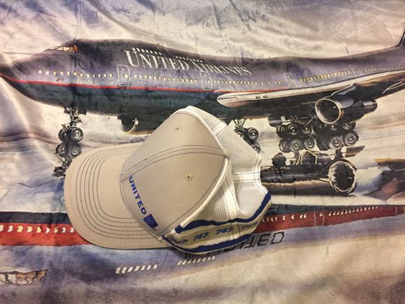 Got a package from FedEx today. It's a table cloth and cap with 747 written all around it. Nice surprise from United! 