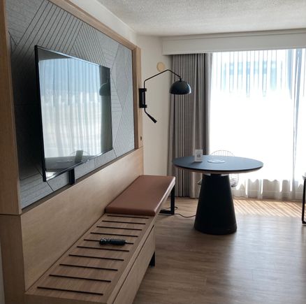 Dining table/desk with outlets elevates electrically