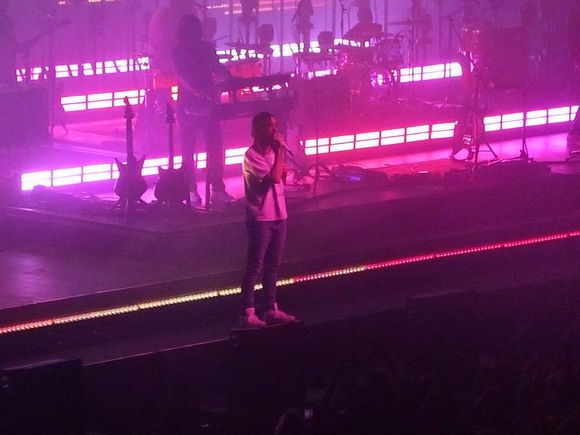Kevin walking around the lip of the stage