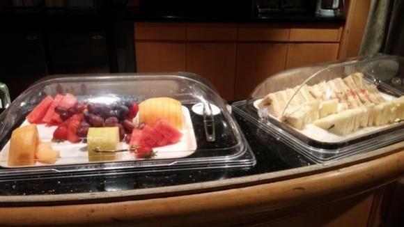 assorted fruit and finger sandwiches -- I didn't try any but looked like egg salad, cheese (I think literally just cheese), cucumber-tomato