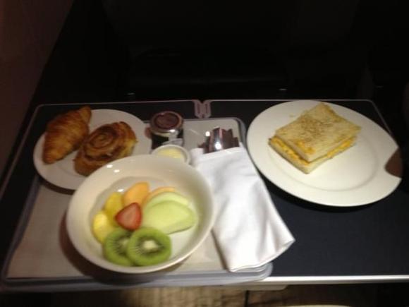 Viennoiseries, fruit and ham and cheese toastie breakfast
