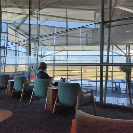 Lovely view of the ramp and the concourse, sadly no photography opportunities. At this time I was seriously considering my options and the amazing lounge angels kept me updated on the ETD. 

2000 came and still no boarding call, so I chatted with the lounge angel and I decided I would offload and book myself on QF557  BNE-SYD and return home. No luggage meant it was an easy offload, and I could clear immigration and get the bus to the Domestic Terminal with enough time to board my flight home.