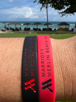 One wristband for all-inclusive, the other for Platinum + guests