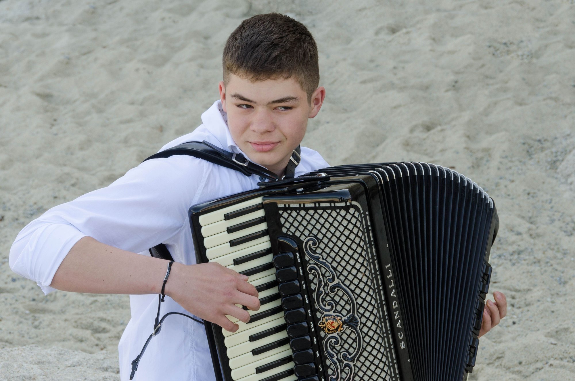 Similarly young Tropean accordion player.