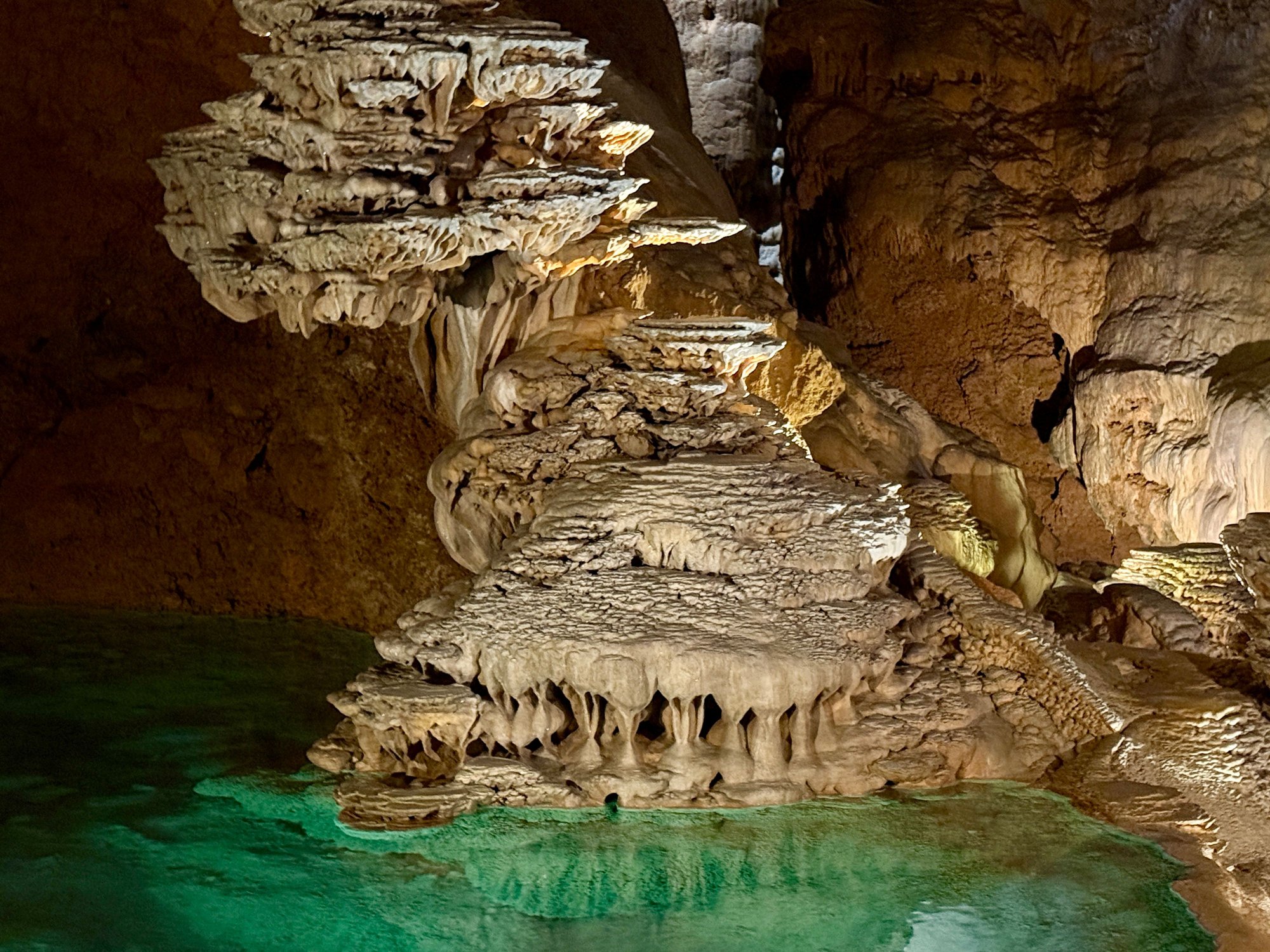 You are surrounded by beautiful formations reflecting off the water