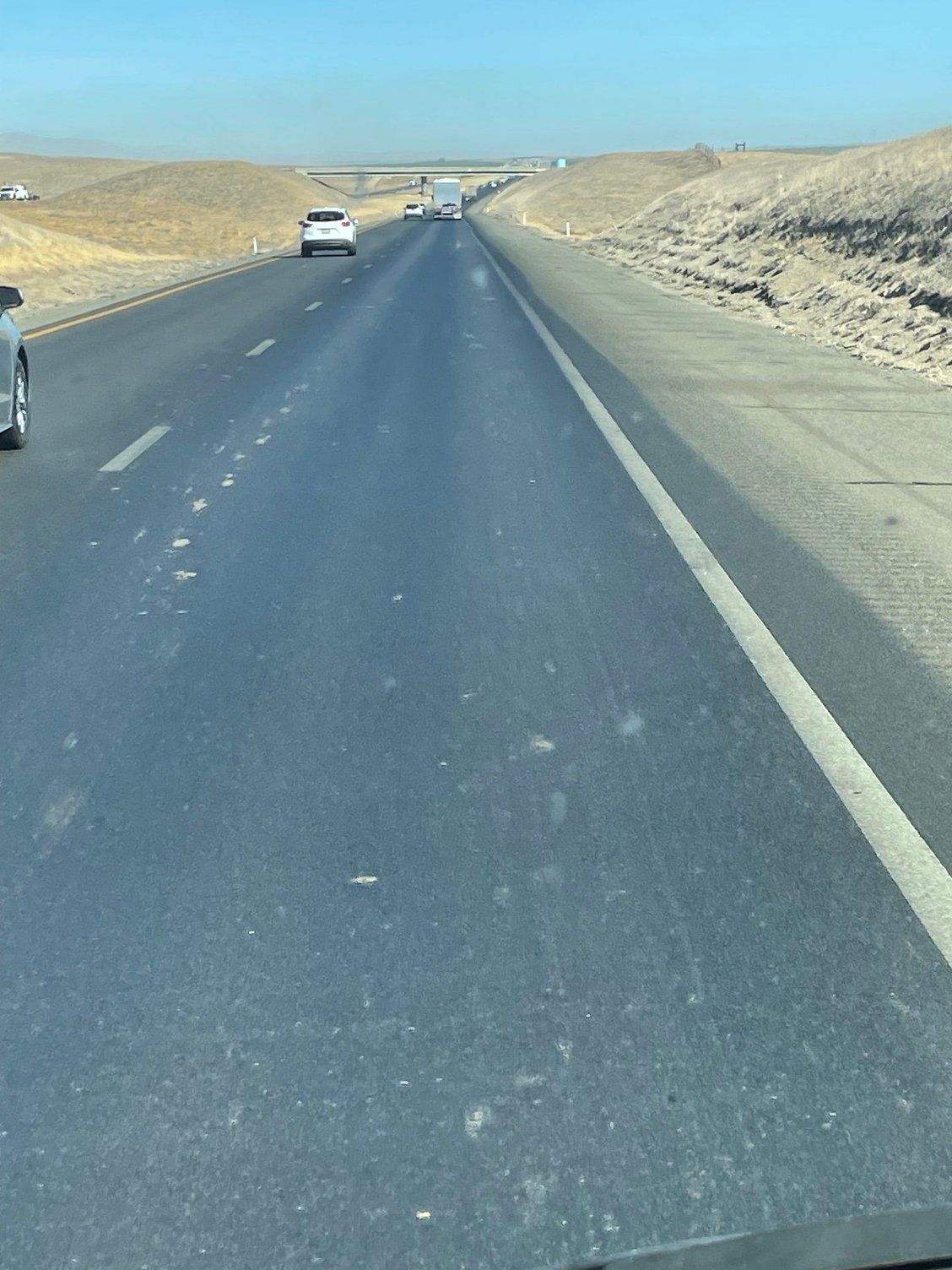 I-5, a desolute, flat humorless road, so straight that when you look into the horizon you can see the back of your own head.