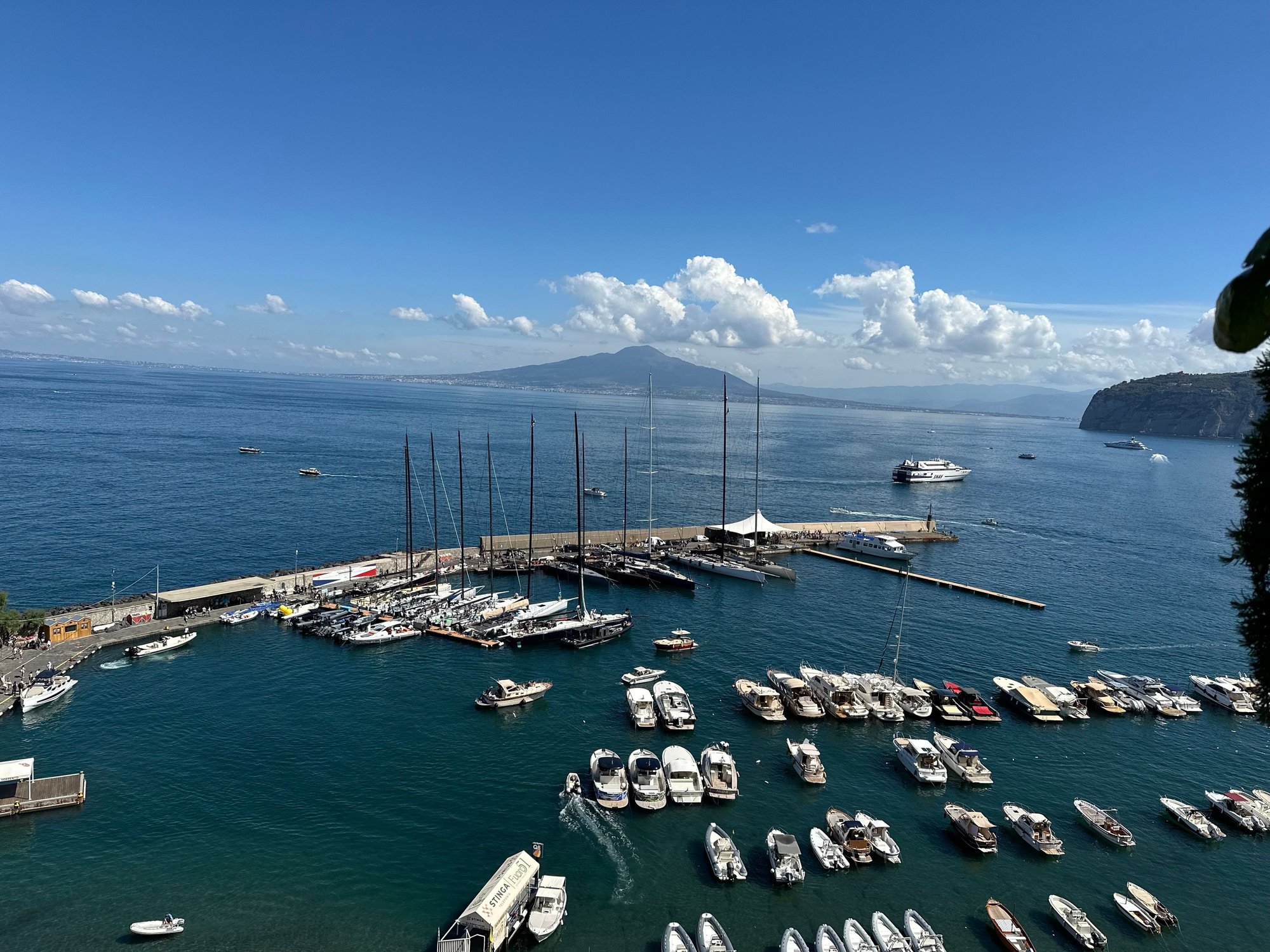View from terrace with marina, ferries and Vesuvius in the distance