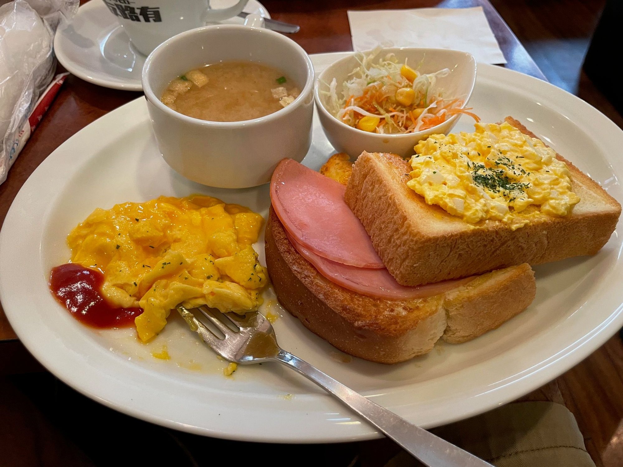 Breakfast was quick and very tasty.  There's scrambled eggs on the left, miso soup, a little salad, and egg salad toast with ham