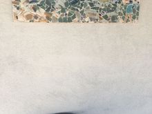 My broken plate mosaic at our front door. 