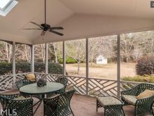 
Excellent screened porch with skylights, just one step down to back yard, so much better for Mr. Fluffy!
