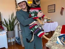 Kenny in his Christmas sweater with his puppy-mom.
