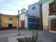 A tiny church.  Actually, the Chapel (Capilla) of the Señor, or Lord, of Pampa Cruz.  I should have looked more closely for an informative plaque, for I would later find that the same internet that will give me ten thousand pages on Elvis in a fraction of a second, had practically nothing to offer on the date of this church.  Eventually I read in the Spanish version of Wikipedia that it is “contemporary with the Temple of San Cristóbal” (preceding picture). 