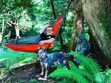 My grandson in the hammock with Libby where she always is, beside him. This is their back yard. See why my heart is in Washington State??