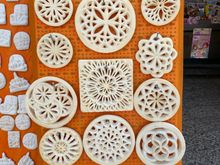 These decorative plates are used to cover the outside of ventilation holes in the caves, creating pretty architectural details along the streets. 