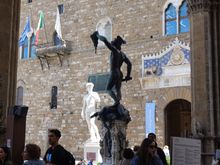 Perseus with the Head of Medusa, and the replica of David in the background