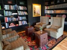 One of many cozy books and crannies in which to relax, read a book or have a drink. 