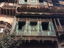 Crumbling, decaying, but still living and breathing.