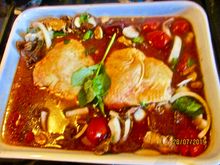 chicken thighs baked with fresh tomatoes and herbs from the garden
