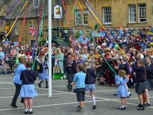 ...students from both of CC's primary schools joined round the Maypole in dance too. 