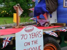Not all supported celebrations of the Queen's Jubilee. This farmer's wife reminded us of the anti-royal graffiti that we'd seen in London's Brick Lane. Her husbear was not shy about parading their private float around town.