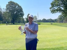 Sandy with his trophy. 