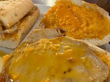 Sandwich opened up to offer inside view...see how lard melts with heat of stove, becoming yellow as opposed to the original orange on the slice at rear......oh, boy, that was great!!!!!